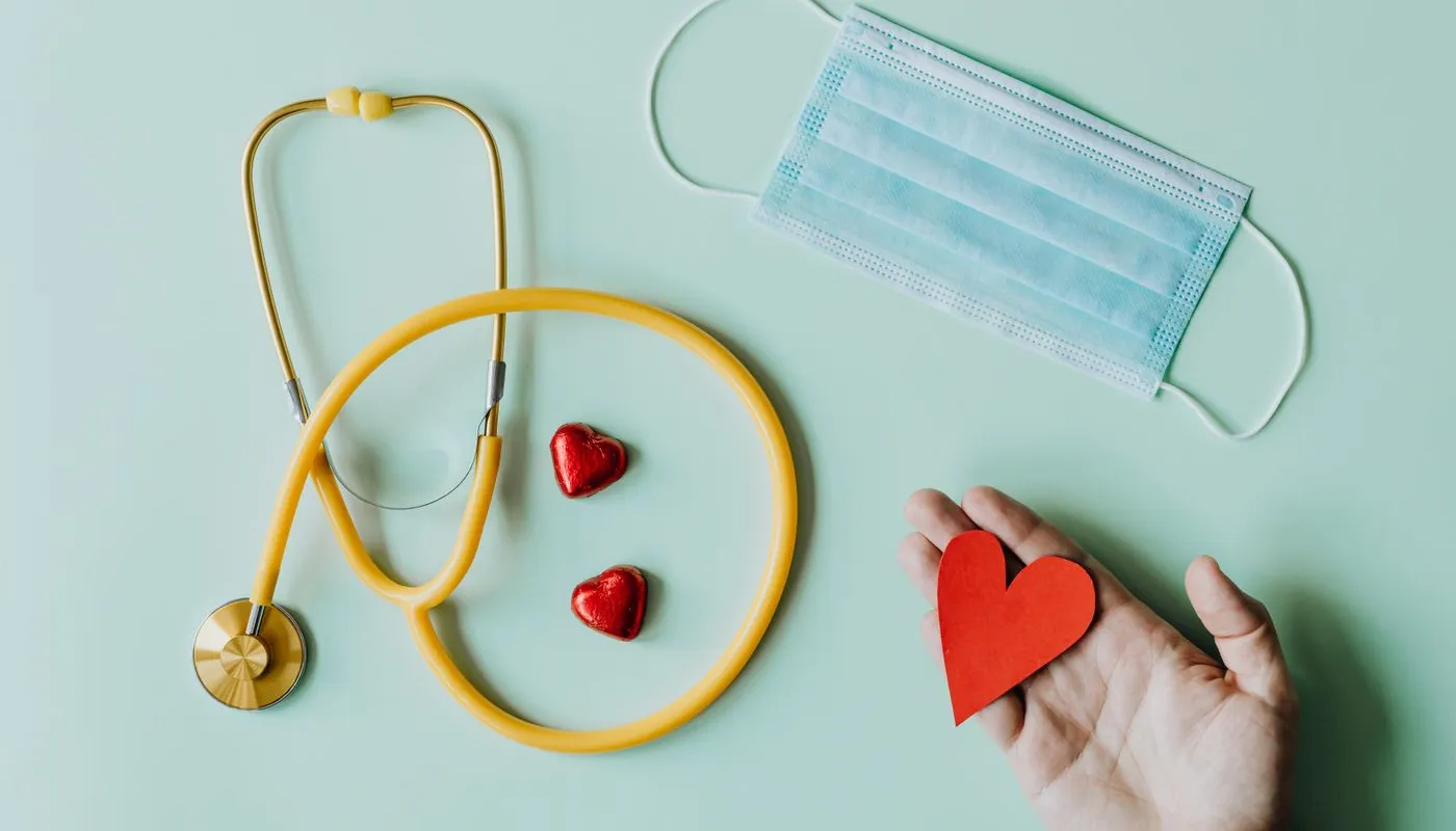 Healthcare essentials — stethoscope and medical mask flat lay, representing the US healthcare domain Mednoria RCM supports.